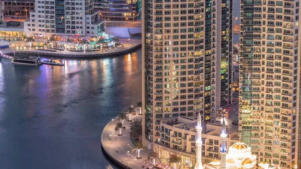 Modern residential architecture of Dubai Marina and Mohammed Bin Ahmed Almulla Mosque aerial day to night timelapse — Stock Photo, Image