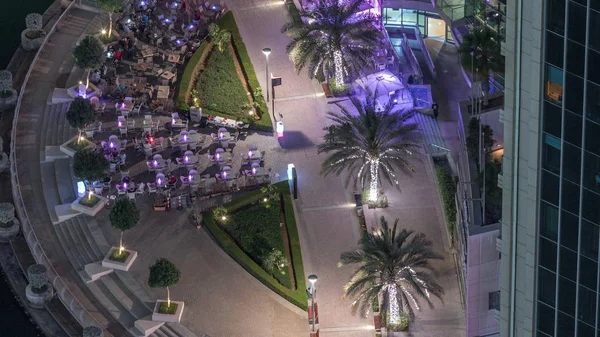 Paseo marítimo en Dubai Marina timelapse noche aérea. Dubai, Emiratos Árabes Unidos —  Fotos de Stock