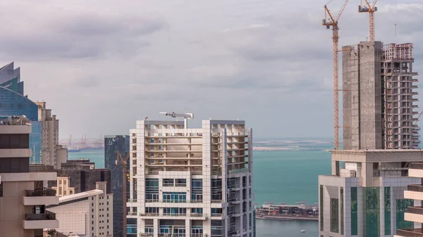 Modern buildings on Dubai Marina and JBR with construction site aerial timelapse in Dubai, United Arab Emirates — Stock Photo, Image