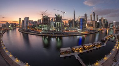 Dubai city center at sunset near river aerial timelapse
