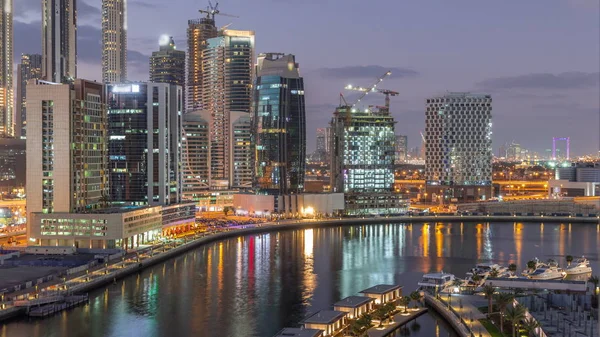 Dubai skyscrapers after sunset near river aerial day to night timelapse — Stock Photo, Image