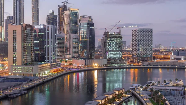 Dubai skyscrapers after sunset near river aerial day to night timelapse — Stock Photo, Image