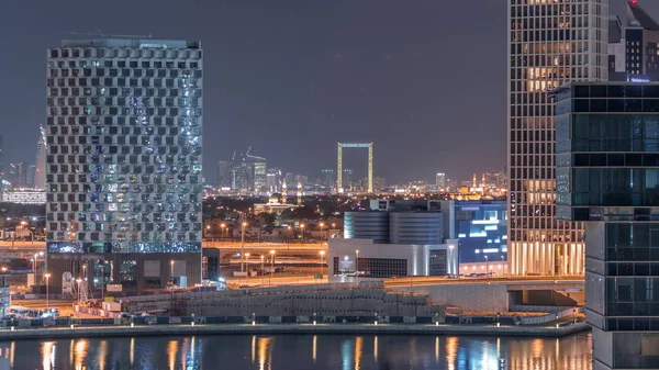 Bright night in Dubai near canal aerial timelapse — Stock Photo, Image