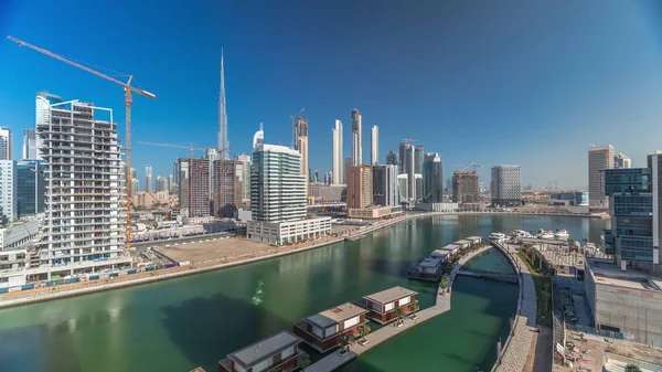 Skyscrapers near canal in Dubai with blue sky aerial timelapse — Stock Photo, Image