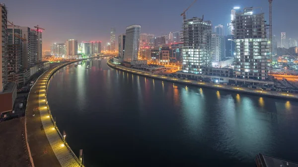 El ritmo de la ciudad de Dubái de noche a día de transición aérea timelapse —  Fotos de Stock