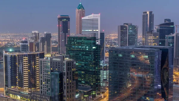 Panorama of Business Bay Dubai night to day air timelapse. — стокове фото