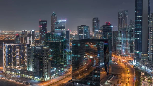 Torre de la bahía de negocios de Dubái timelapse noche aérea . —  Fotos de Stock