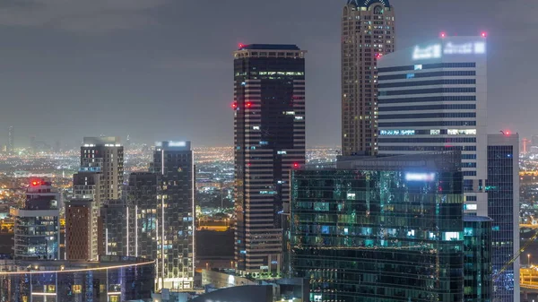 Dubai's business bay towers aerial night timelapse. — ストック写真