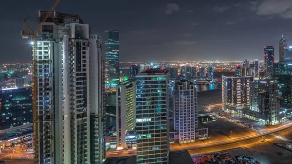 Dubai's business bay towers aerial night timelapse. — ストック写真