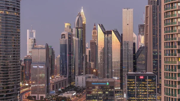 Dubai International Financial Centre district with modern skyscrapers day to night timelapse — Stock Photo, Image