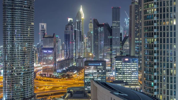 Dubai International Financial Centre district with modern skyscrapers night timelapse — Stock Photo, Image