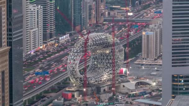 Cantiere del Museo del Futuro aereo da giorno a notte timelapse, prossimo edificio iconico di Dubai . — Video Stock