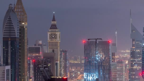 Dubai International Financial Centre District med moderna skyskrapor natt till dag Timelapse — Stockvideo