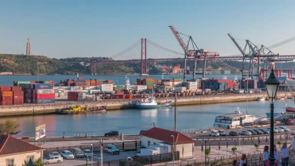 Skyline over Lisbon commercial port timelapse, 25th April Bridge, containers on pier with freight cranes — Stock Video