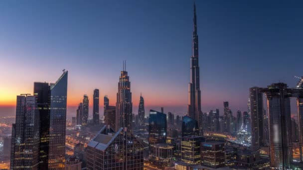 Dubai downtown skyline with tallest skyscrapers and busiest traffic on highway intersection night to day timelapse — Stock Video