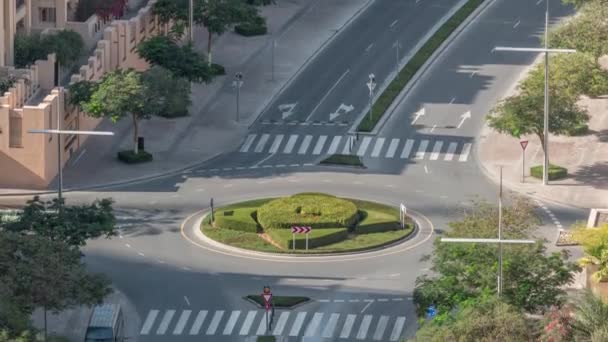 Aerial view of a roundabout circle road in Dubai downtown from above timelapse. Dubai, United Arab Emirates. — Stock Video