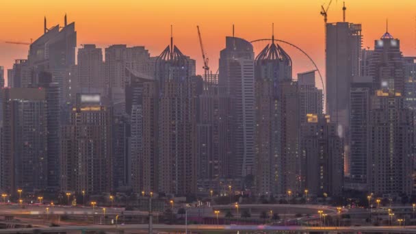 Dubai Marina skyscrapers and golf course day to night timelapse, Dubai, United Arab Emirates — Stock Video