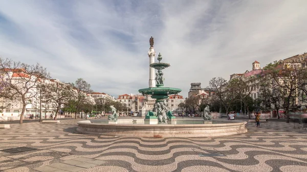Rossio square with fountain and monument on column located at Baixa district timelapse hyperlapse in Lisbon, Portugal — стокове фото
