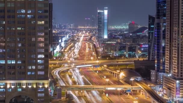 Skyline internet cidade com cruzamento Sheikh Zayed Estrada aérea noite timelapse — Vídeo de Stock