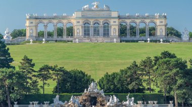 Gloriette pavilion and Neptune fountain in Schonbrunn park timelapse clipart