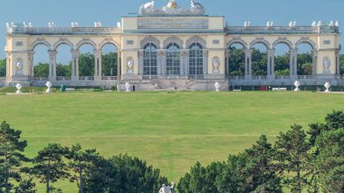 Gloriette pavilion and Neptune fountain in Schonbrunn park timelapse clipart