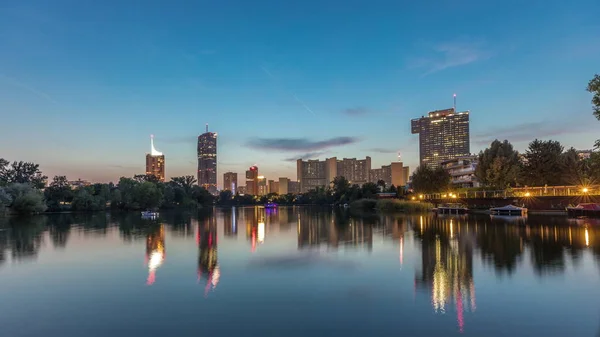 Vienna international center skyscrapers with Kaiserwasser lake reflection view day to night timelapse — 스톡 사진