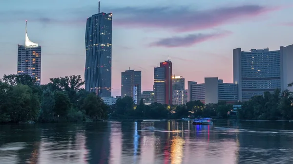 Vienna international center skyscrapers with Kaiserwasser lake reflection view day to night timelapse — 스톡 사진