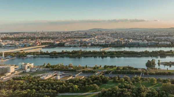 Aerial panoramic view of Vienna city with skyscrapers, historic buildings and a riverside promenade timelapse in Austria. — 스톡 사진