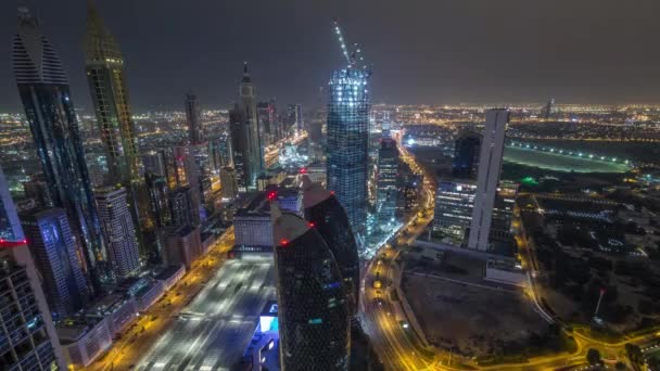 Skyline of the buildings of Sheikh Zayed Road and DIFC aerial night timelapse in Dubai, UAE. — Stok Video