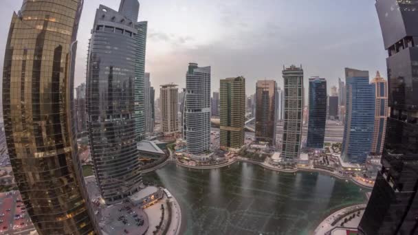 Residential and office buildings in Jumeirah lake towers district day to night timelapse in Dubai — Stock Video