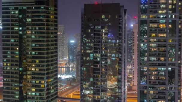 Residential and office buildings in Jumeirah lake towers district night timelapse in Dubai — Stock Video