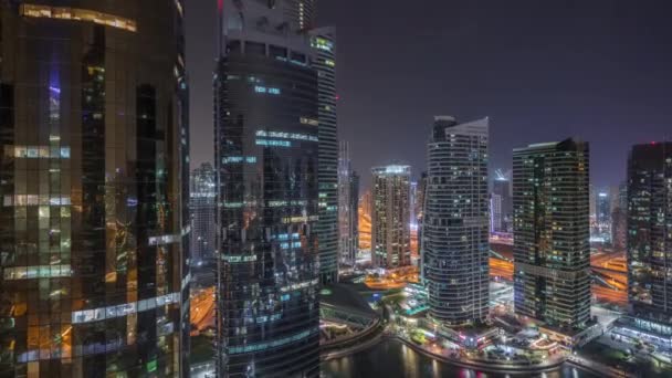 Residential and office buildings in Jumeirah lake towers district night timelapse in Dubai — Stock Video