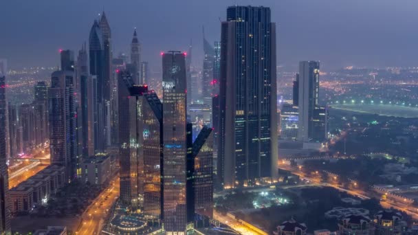 Dubai International Financial Centre District med moderna skyskrapor natt till dag Timelapse — Stockvideo