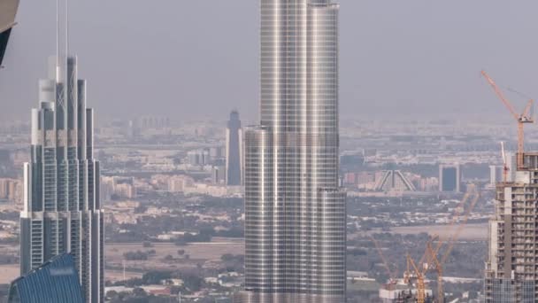 Panoramic aerial view of downtown towers from business bay in Dubai at evening timelapse. — Stock Video