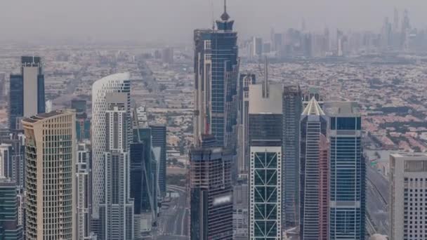 Dubai Centro skyline paisaje urbano futurista con muchos rascacielos y Burj Khalifa timelapse aéreo . — Vídeos de Stock