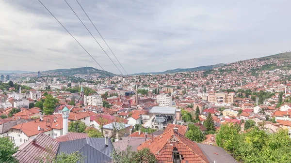 City panorama with cable car moving up and down from Sarajevo station to mountains, Bosnia And Herzegovina