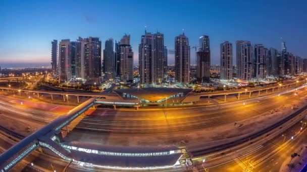 Aerial top view to Sheikh Zayed road near Dubai Marina and JLT night to day timelapse, Dubai. — ストック動画