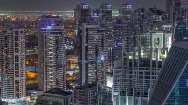 Dubai Marina skyscrapers and jumeirah lake towers view from the top aerial night timelapse in the United Arab Emirates. — Stock Video