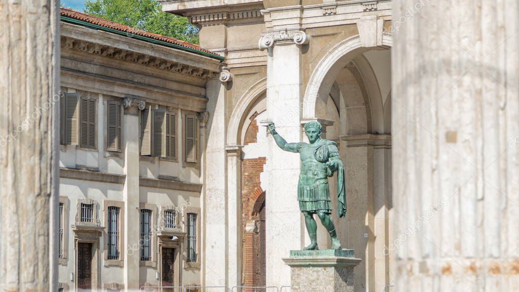 Monument to Roman emperor Constantine I timelapse framed by columns in Milan, in front of San Lorenzo Maggiore basilica. This bronze statue is a modern copy of a Roman statue in Rome.