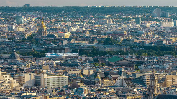 Panorama of Paris timelapse with Les Invalides, France. Top view from Sacred Heart Basilica of Montmartre (Sacre-Coeur). Sunny day with blue cloudy sky.