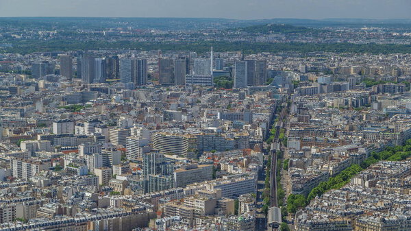 Top view of Paris skyline from above timelapse. Main landmarks of european megapolis with Boulevard de Grenelle and metro line. Bird-eye view from observation deck of Montparnasse tower. Paris, France