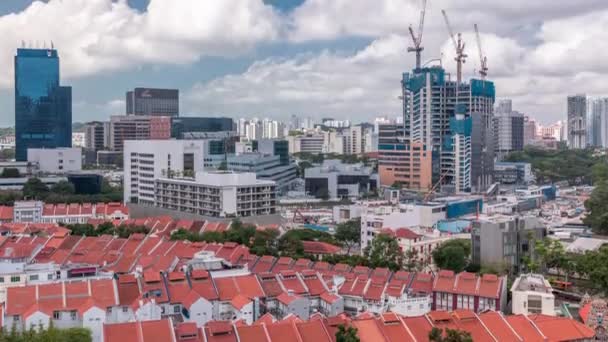 Aerial view of Chinatown with red roofs and Central Business District skyscrapers timelapse, Singapore — Stock Video