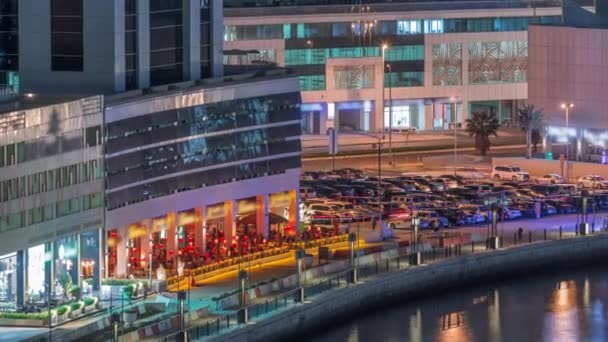 Parking near canal in Dubai at night, UAE aerial timelapse — Stock Video