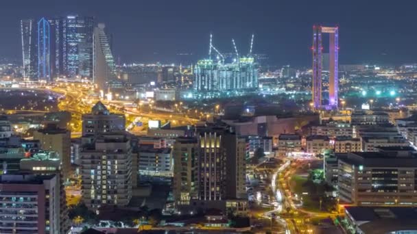 Vue de la ville éclairée par le rythme avec des gratte-ciel à Dubaï timelapse aérien — Video