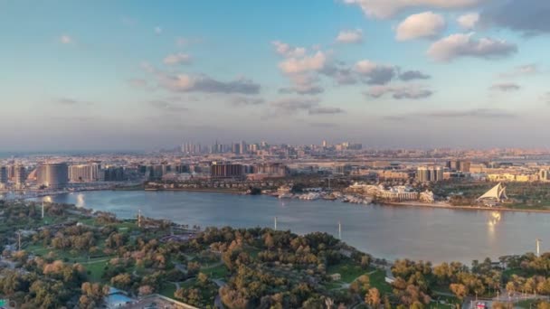 View of new modern city with green trees in luxury Dubai city, United Arab Emirates Timelapse Aerial — ストック動画