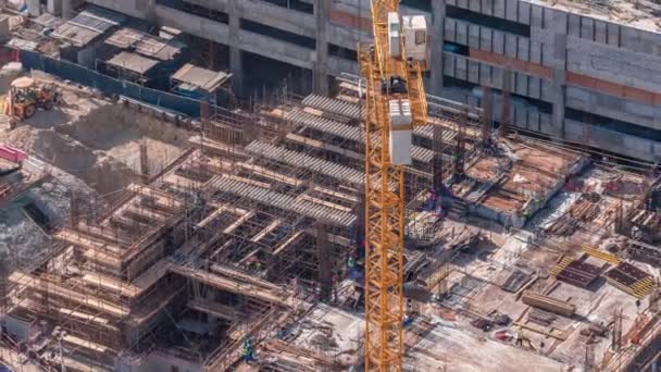 Vista aérea de la construcción con máquinas especiales en Business Bay, Dubai timelapse — Vídeos de Stock