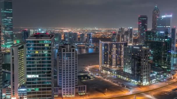 Dubais business bay towers aerial night timelapse. — Stock video