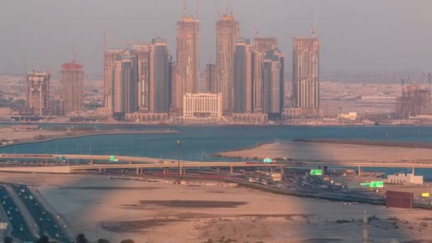 Construcción de nuevos rascacielos en Dubai Creek Harbor timelapse aéreo. Dubai - Emiratos Árabes Unidos . — Vídeo de stock