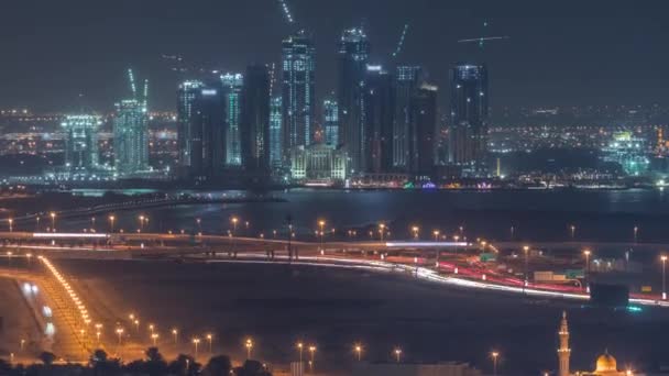 Bau neuer Wolkenkratzer im Dubai Creek Harbour im Zeitraffer der Nacht. dubai - uae. — Stockvideo