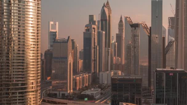 Dubai International Financial Centre district met moderne wolkenkrabbers timelapse bij zonsopgang — Stockvideo